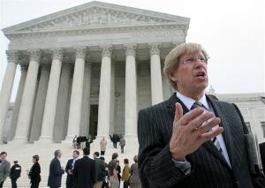 Former Solicitor General Theodore Olson speaks to reporters outside the Supreme Court in Washington in this Nov. 29, 2006, file photo. In the search for a new attorney general, President Bush is seeking someone who can survive a tough confirmation process after months of scandal at the Justice Department, and OlsonÍs is among the frequently mentioned names for the job. (AP Photo/Lauren Victoria Burke, File)<br />